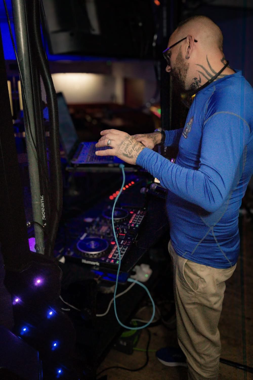 Dale at the decks under blue stage lighting